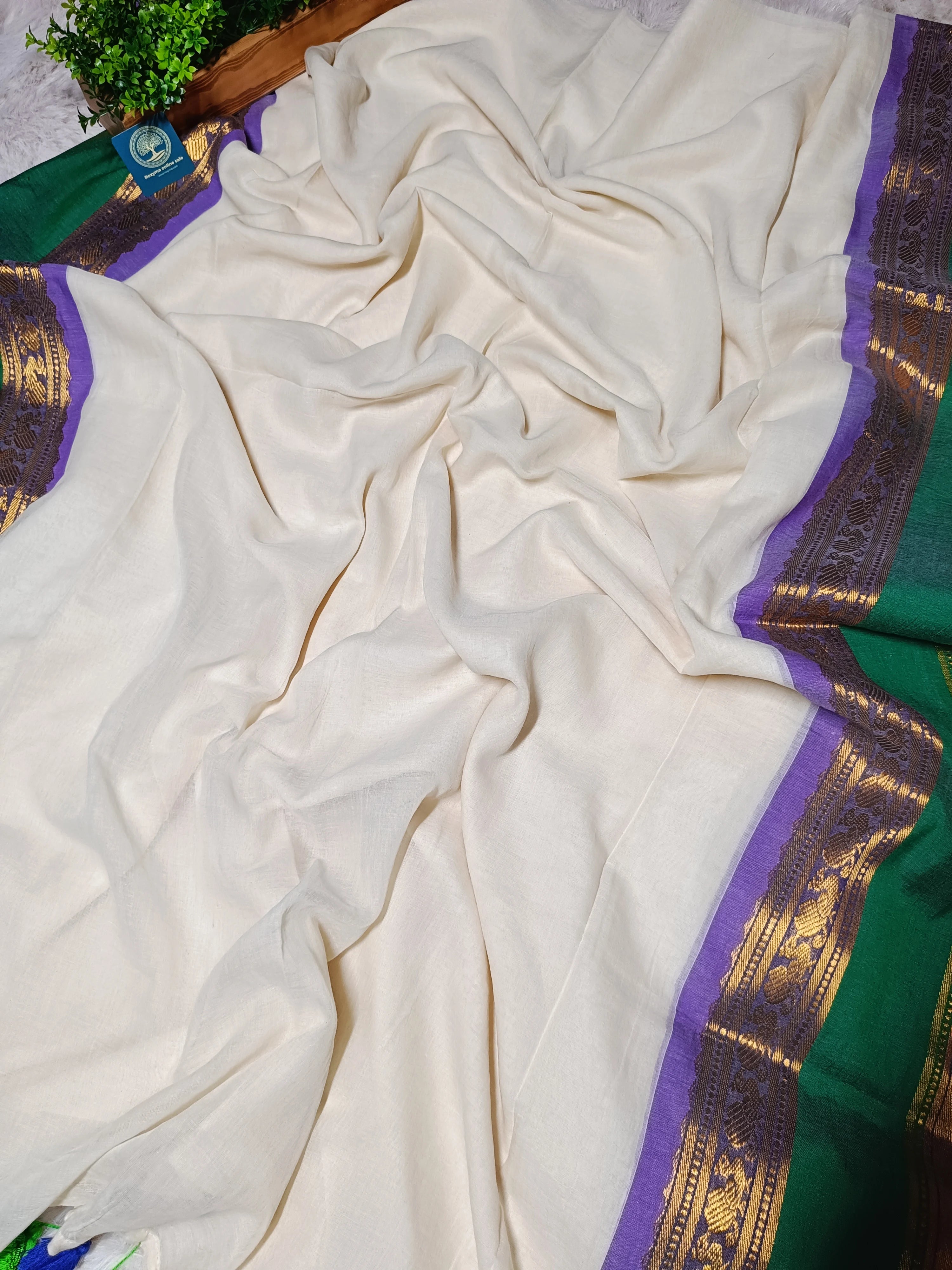 White saree with green and purple border