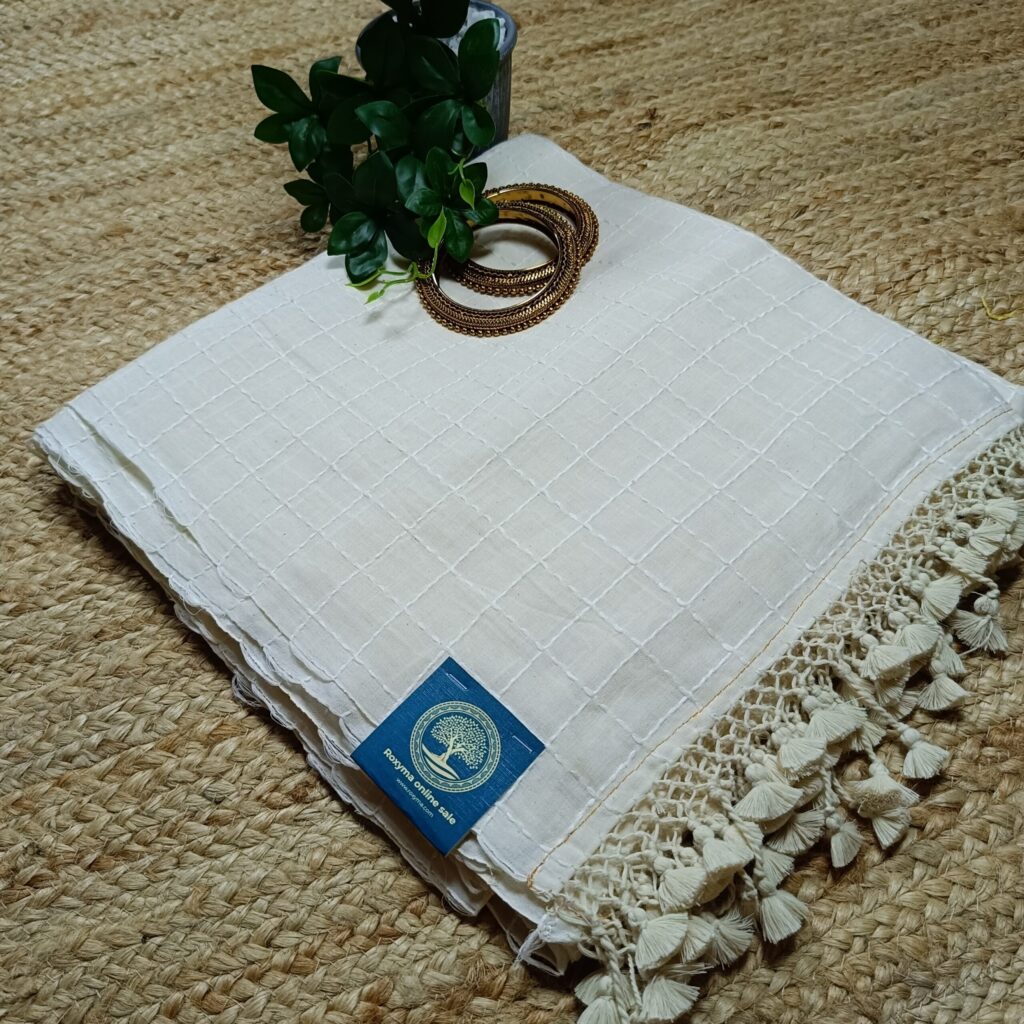 handcrafted tradition with this Handloom Cotton Saree featuring intricate Kantha stitch embroidery all over and charming pompom detailing.